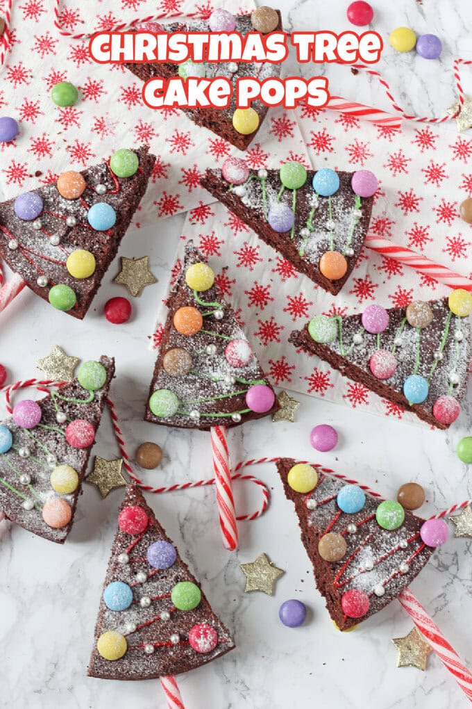 Christmas Tree Cake Pops decorated with red and white candy canes, green and red icing, smarties and edible metallic balls.